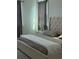 Relaxing main bedroom with king bed, soft bedding, and neutral color palette at 14739 Glade Hill Park Way, Winter Garden, FL 34787