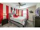 Mickey Mouse themed bedroom with a queen bed and red accents at 1212 Challenge Dr, Davenport, FL 33896