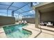 Private screened-in pool and patio furniture at 1212 Challenge Dr, Davenport, FL 33896