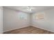 Spacious bedroom with hardwood floors and two windows at 129 Ocean Grove Dr, Ormond Beach, FL 32176