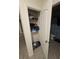 Linen closet with shelving for extra storage at 1295 Berry Ln, Davenport, FL 33837