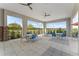 Relaxing community patio with tables, chairs, and ceiling fans, offering scenic views at 1683 Three Bars Rd, Kissimmee, FL 34744