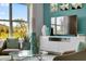 Relaxing living room with large window and teal decor at 1683 Three Bars Rd, Kissimmee, FL 34744
