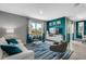 Modern living room with white couch and teal accent wall at 1683 Three Bars Rd, Kissimmee, FL 34744