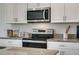 Stainless steel appliances and granite countertops in this kitchen at 1683 Three Bars Rd, Kissimmee, FL 34744