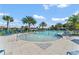 Enjoy this community resort-style pool with palm trees at 1683 Three Bars Rd, Kissimmee, FL 34744
