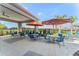Relaxing poolside patio with tables and umbrellas at 1683 Three Bars Rd, Kissimmee, FL 34744