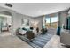 Spacious living room with white couch and teal accents at 1683 Three Bars Rd, Kissimmee, FL 34744