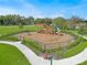 Community playground with swings, slides, and play structures at 1683 Three Bars Rd, Kissimmee, FL 34744