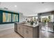 Modern kitchen with granite countertops and stainless steel appliances at 1683 Three Bars Rd, Kissimmee, FL 34744