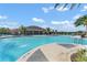 Community pool area with a clubhouse in the background at 1683 Three Bars Rd, Kissimmee, FL 34744