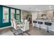 Bright dining area with white table and chairs, looking toward kitchen at 1683 Three Bars Rd, Kissimmee, FL 34744