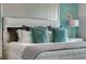 Elegant Primary bedroom with plush bedding and accent pillows at 1683 Three Bars Rd, Kissimmee, FL 34744