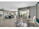 Open concept dining area with white table and chairs, view of living room at 1683 Three Bars Rd, Kissimmee, FL 34744