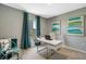 Home office with a desk, chair, and teal curtains at 1683 Three Bars Rd, Kissimmee, FL 34744