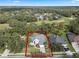 Aerial view of a single-Gathering home with nicely landscaped yard at 2138 Inverness Ct, Oviedo, FL 32765