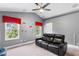 Bonus room with vaulted ceiling, black leather couch and ceiling fan at 2138 Inverness Ct, Oviedo, FL 32765