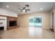 Bright living room with fireplace, pool view, and sliding glass doors at 2518 Sweetwater Trl, Winter Park, FL 32789