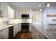 Modern kitchen featuring granite countertops and stainless steel appliances at 2518 Sweetwater Trl, Winter Park, FL 32789