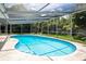 Kidney shaped pool with screened enclosure at 2518 Sweetwater Trl, Winter Park, FL 32789