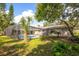 Home with a screened pool and lush landscaping at 2518 Sweetwater Trl, Winter Park, FL 32789