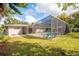 Screened kidney shaped pool in backyard at 2518 Sweetwater Trl, Winter Park, FL 32789