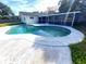 Inviting kidney-shaped pool with a screened enclosure at 2925 Banchory Rd, Winter Park, FL 32792