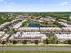 Aerial view of community featuring a lake and lush landscape at 3215 Brasilia Ave, Kissimmee, FL 34747