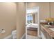 Modern bathroom with double vanity and a toilet at 3215 Brasilia Ave, Kissimmee, FL 34747
