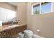 Modern bathroom with granite vanity and toilet at 3215 Brasilia Ave, Kissimmee, FL 34747