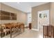 Small dining area next to a half bathroom at 3215 Brasilia Ave, Kissimmee, FL 34747