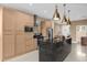 Modern kitchen features stainless steel appliances and an island at 3215 Brasilia Ave, Kissimmee, FL 34747