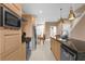 Modern kitchen with stainless steel appliances and an island at 3215 Brasilia Ave, Kissimmee, FL 34747