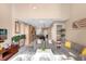 Open concept living room with high ceilings and kitchen view at 3215 Brasilia Ave, Kissimmee, FL 34747