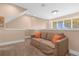 Cozy loft area with comfortable couch and neutral decor at 3215 Brasilia Ave, Kissimmee, FL 34747