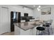 Modern kitchen boasts an island and stainless steel appliances at 4285 Quote St, Kissimmee, FL 34746