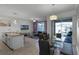 Open concept dining area with glass table and access to the patio at 4285 Quote St, Kissimmee, FL 34746