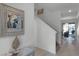 Bright and airy entryway with staircase and view to dining area at 4285 Quote St, Kissimmee, FL 34746