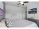 Bedroom with purple accent wall, large bed, and ample closet space at 4285 Quote St, Kissimmee, FL 34746