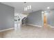 Open dining area with gray walls and tile floors, showing access to staircase at 5353 White Blossom Cir, Saint Cloud, FL 34771