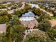 Aerial view of community pool, clubhouse, and lake at 6434 Cava Alta Dr # 410, Orlando, FL 32835