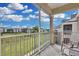 Screened balcony overlooking a grassy courtyard at 8100 Princess Palm Ln # 305, Kissimmee, FL 34747