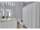 Simple bathroom with shower/tub and white vanity at 8100 Princess Palm Ln # 305, Kissimmee, FL 34747