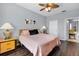 Main bedroom with king bed, ample light, and access to bathroom at 8100 Princess Palm Ln # 305, Kissimmee, FL 34747