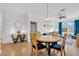 Dining area with wood table and four chairs at 8100 Princess Palm Ln # 305, Kissimmee, FL 34747