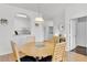 Dining area with wood table and four chairs at 8100 Princess Palm Ln # 305, Kissimmee, FL 34747