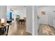 View of the dining area and kitchen from entryway at 8100 Princess Palm Ln # 305, Kissimmee, FL 34747