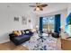 Living room with sectional sofa and large window at 8100 Princess Palm Ln # 305, Kissimmee, FL 34747