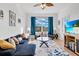 Living room with sectional sofa and large window at 8100 Princess Palm Ln # 305, Kissimmee, FL 34747