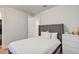 Simple bedroom with a gray bed, and access to a hallway at 9248 Hanging Vine Ct, Orlando, FL 32836